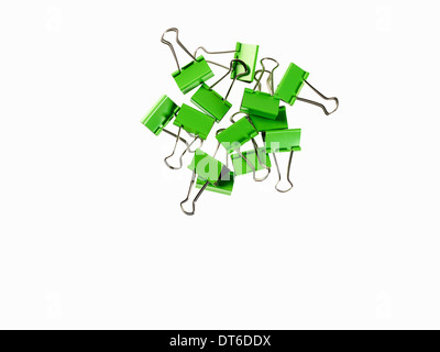 Green Office Supplies. Paperclips on a white background. Stock Photo