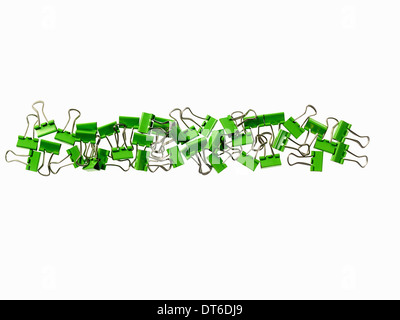 Green Office Supplies. Paperclips on a white background. Stock Photo