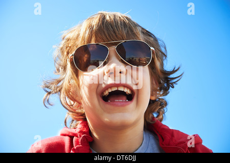 Close up portrait of happy young boy in sunglasses Stock Photo