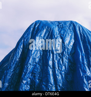 A blue tarpaulin, draped over commercial fishing nets, Fisherman's Terminal, Seattle Stock Photo