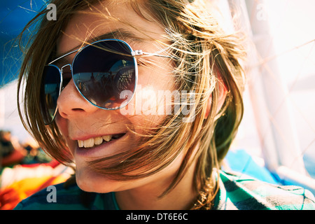 Close up candid portrait of boy in sunglasses Stock Photo