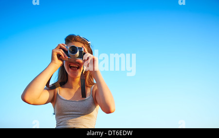 Candid portrait of girl looking through camera Stock Photo