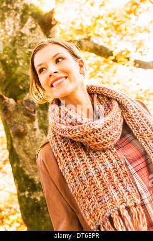 Portrait of young woman wearing knitted scarf