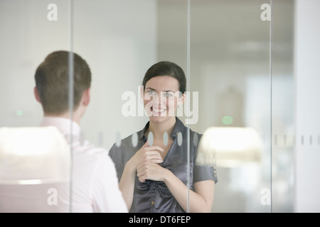Business colleagues in discussion through glass Stock Photo