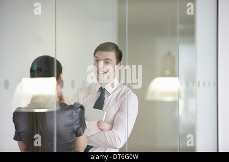 Business colleagues in discussion through glass Stock Photo