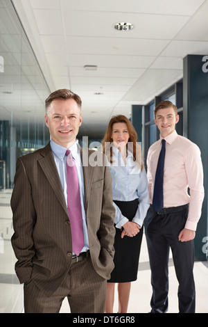 Portrait of business colleagues in corridor Stock Photo