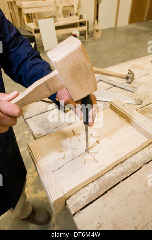 Man working in carpentry / woodwork workshop Stock Photo