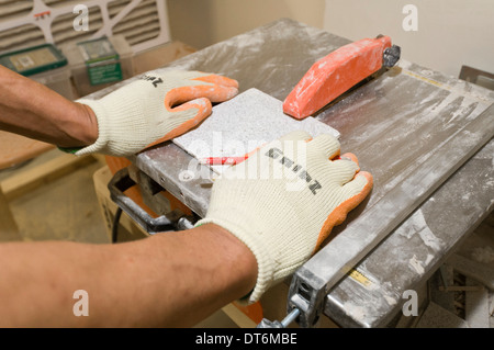 Man cutting ceramic tile Stock Photo
