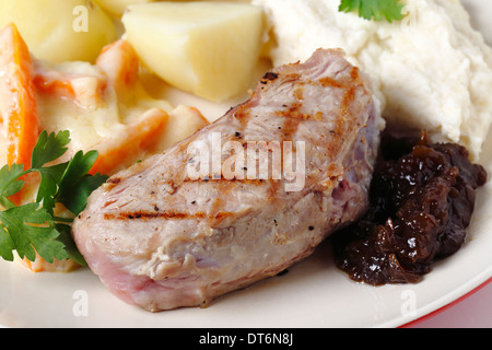 Veal sirloin steak with onion marmalade, celeriac puree, julienned carrots in a white sauce and boiled potatoes, Stock Photo