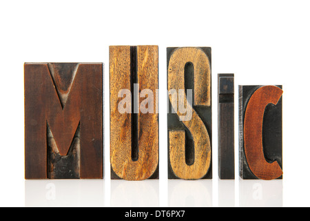 Music in vintage print letters over white background Stock Photo