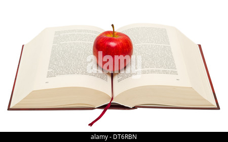 Red apple placed on an open book isolated on white background. Stock Photo