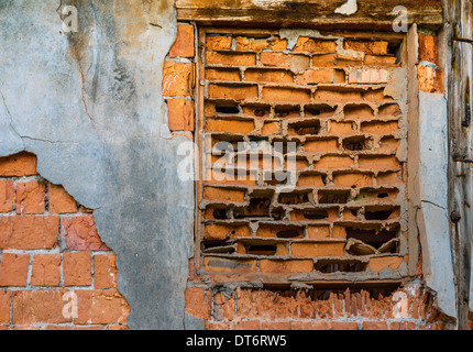 Ancient brick wall of old fractured decaying Stock Photo