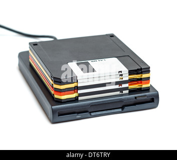 External usb floppy disk drive with disks isolated on white background Stock Photo