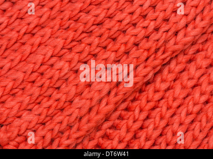 Red knitted merino wool background stockinette stitch Stock Photo
