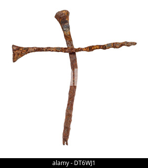Old handforged rusty nails in shape of cross isolated on white background Stock Photo