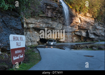 Bridal Veil Falls near Highlands, NC, provides an opportunity for drivers to drive behind a mountain waterfall along Highway 64. (USA) Stock Photo