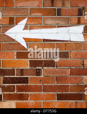 arrow on wall Stock Photo