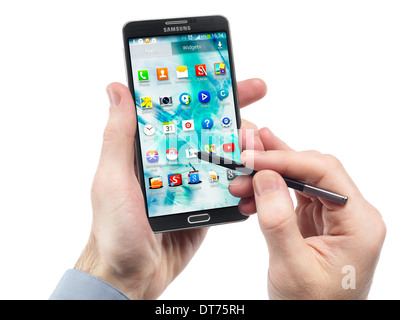 Man hands with Samsung Galaxy Note III smartphone isolated on white background Stock Photo