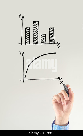 Businessman drawing chart and other infographics in note pad. Close up image with selective focus. Business situation. Stock Photo