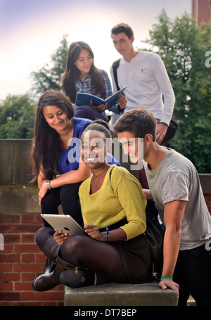 Students at the University of Birmingham, with the Joseph Chamberlain Memorial Clock Tower UK Stock Photo