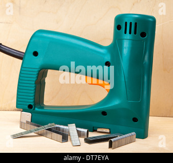 The tool - staplers electrical and manual mechanical - for repair work in the house and on furniture, and brackets Stock Photo