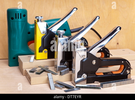 The tool - staplers electrical and manual mechanical - for repair work in the house and on furniture, and brackets Stock Photo