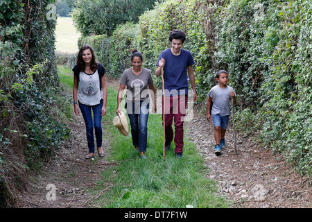 Family walking on a country path Stock Photo