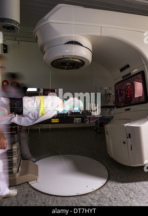 Male cancer under a linear accelerator or linac receiving radiation ...