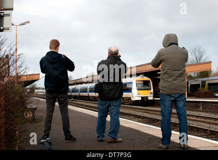 Rail enthusiasts photographing a Chiltern Railways diesel train, Leamington Spa, UK Stock Photo