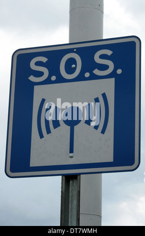 An SOS road sign on the side of a street in Cotacachi, Ecuador Stock Photo