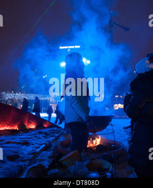 Umea, Vasterbotten, Sweden. 1st Feb, 2014. 1 February 2014, Umea, Sweden: Opening weekend festivities as the city of Umea, Sweden was ushered in as the 2014 Culture Capital of Europe promantly displayed Sami culture and customs. This typical Sami shelter, consisting of a huge boiling caldron cooking broth of reindeer meat over an open fire surrounded by fur-covered floor, is here installed at Radhustorget, Umea's main square. © Rob Schoenbaum/ZUMA Wire/ZUMAPRESS.com/Alamy Live News Stock Photo