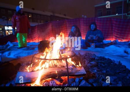 Umea, Vasterbotten, Sweden. 1st Feb, 2014. 1 February 2014, Umea, Sweden: Opening weekend festivities as the city of Umea, Sweden was ushered in as the 2014 Culture Capital of Europe promantly displayed Sami culture and customs. This typical Sami shelter, consisting of a huge boiling caldron cooking broth of reindeer meat over an open fire surrounded by fur-covered floor, is here installed at Radhustorget, Umea's main square. © Rob Schoenbaum/ZUMA Wire/ZUMAPRESS.com/Alamy Live News Stock Photo