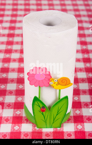 Wood kitchen paper towel holder on table Stock Photo