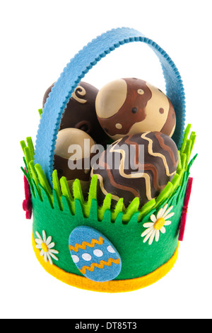 Felting basket full chocolate easter eggs isolated over white background Stock Photo