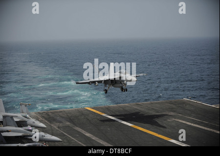 Gulf of Oman, July 12, 2013 - An F/A-18F Super Hornet lands on the aircraft carrier USS Nimitz. Stock Photo
