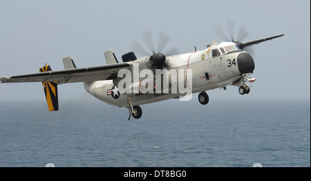 Gulf of Oman, August 24, 2013 - A C-2A Greyhound flies over the flight deck of the aircraft carrier USS Nimitz. Stock Photo