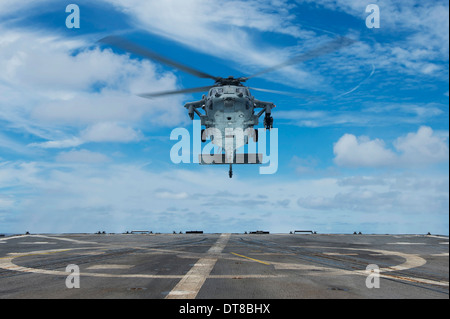 A U.S. Navy MH-60S Seahawk helicopter prepares to land. Stock Photo