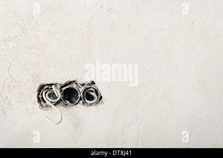 Electrical installation. Power sockets on initial stage of construction.  Stock Photo