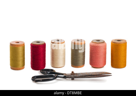 Scissors and spools isolated on white Stock Photo