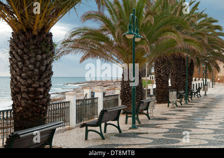 cobbled promenade by the beach of Praia da Luz in the western Algarve region of Portugal Stock Photo