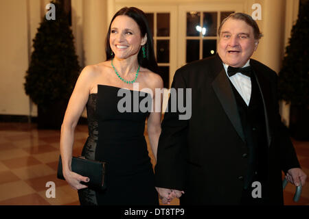 Washington DC, USA. 11th Feb, 2014. Actress Julia Louis-Dreyfus, left, and William Louis-Dreyfus arrive to a state dinner hosted by U.S. President Barack Obama and first lady Michelle Obama in honor of French President Francois Hollande at the White House in Washington, USA, 11 February 2014. Obama and Hollande said the U.S. and France are embarking on a new, elevated level of cooperation as they confront global security threats in Syria and Iran, deal with climate change and expand economic cooperation. Credit: Andrew Harrer / Pool via CNP/dpa/Alamy Live News