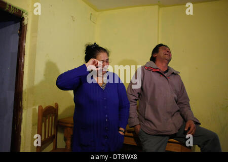 Madrid, Spain. 11th Feb, 2014. Isabel Fernandez Fonseca, 46 years old, left, and her husband Ramon Fernandez 48 years old, right gesture after knowing that their eviction was postponed in Madrid, Spain, Tuesday, Feb. 11, 2014. Isabel and Ramon are part of a nine members family, including two sons, Jose, 11 years old, and Ramon, 25 years old, Ramon's wife, Joana Fernandez Gimenez, 25 years old, and four grand children. They have occupied an apartment, property of the financial aided Bankia bank 4 years ago. They tried to negotiate with the bank to pay a low rent since their income it is a sta Stock Photo