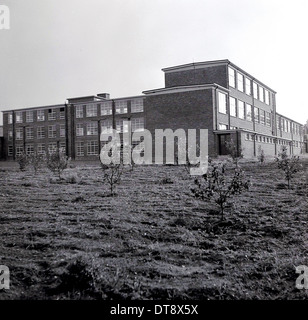 Historical picture from 1960s showing a modern school building. Stock Photo