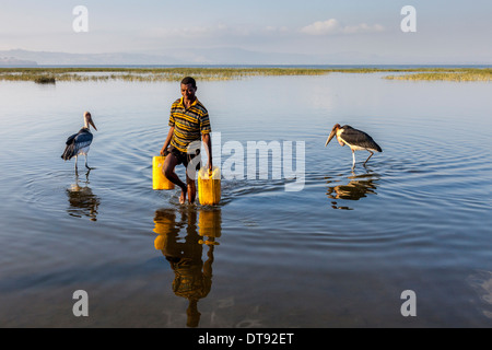 A Local Man Collects Water In Lake Hawassa, Hawassa, Ethiopia Stock Photo