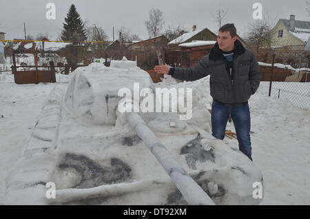 Tambov, Russia. 12th Feb, 2014. The other day two Tambovs friend - Mihail Holoburdin and Silt Borisov blinded from snow tank to models T44. This model was Released at the last years WW2. Blind the tank solved in honour of approaching holiday on February 23. Credit:  Pavel Kashaev/Alamy Live News Stock Photo
