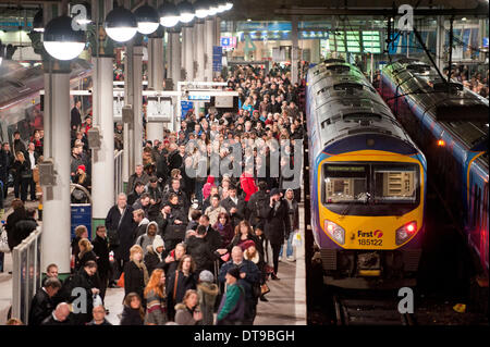 MANCHESTER, UK. 12th February, 2014. A platform at Manchester Piccadilly train station during strong winds across the United Kingdom, which led to to travel disruption for evening commuters  Some travellers were advised to postpone their travel plans for the day. Credit:  Russell Hart/Alamy Live News. Stock Photo