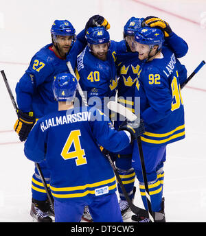 Sochi, Krasnodar Krai, Russia. 12th Feb, 2014. Swedish players celebrate their team's third goal during the Men's Ice Hockey preliminary round between Sweden and the Czech Republic at the Bolshoy Ice Dome, Coastal Cluster - XXII Olympic Winter Games Credit:  Action Plus Sports/Alamy Live News Stock Photo