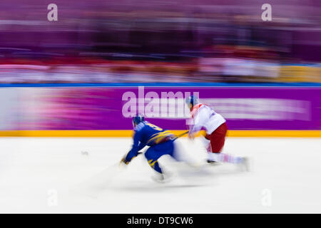 Sochi, Krasnodar Krai, Russia. 12th Feb, 2014. Motion blur of a breakaway during the Men's Ice Hockey preliminary round between Sweden and the Czech Republic at the Bolshoy Ice Dome, Coastal Cluster - XXII Olympic Winter Games Credit:  Action Plus Sports/Alamy Live News Stock Photo