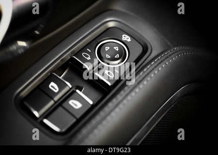 Detail on buttons controlling the windows in a car Stock Photo