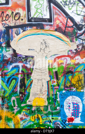 The iconic John Lennon Wall memorial in the Little Quarter, Prague, Czech Republic covered with colourful tribute graffiti, paintings and drawings Stock Photo